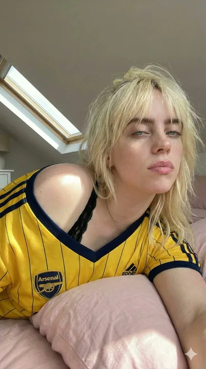 Yellow-shirted football girl under the attic skylight