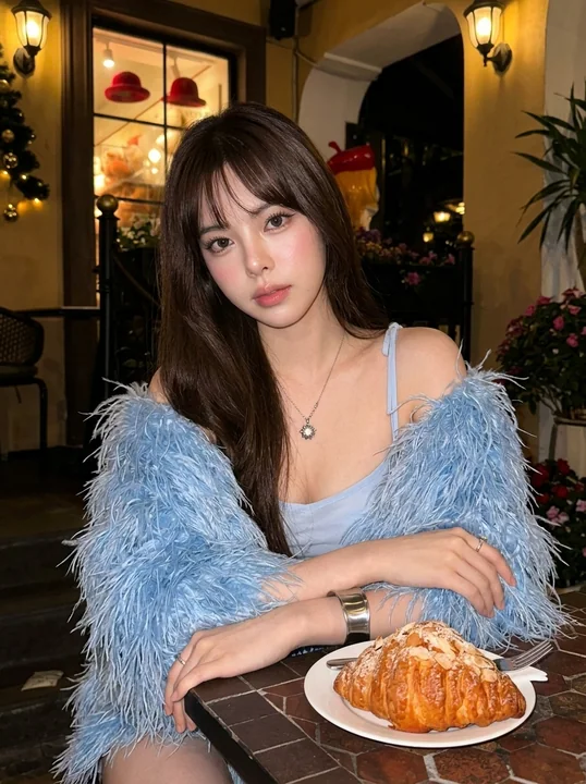 Blue-feathered girl in a warm-light café