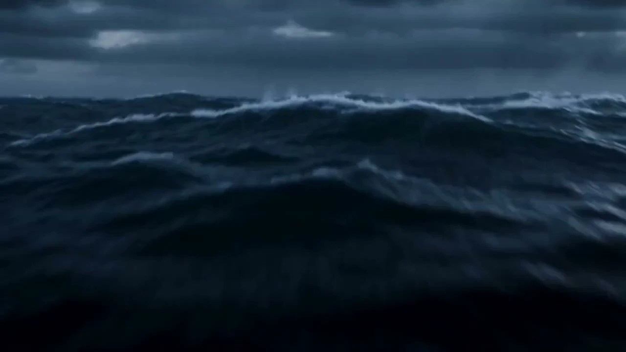 Giant Feline Titan rages against a navy fleet amidst a storm.