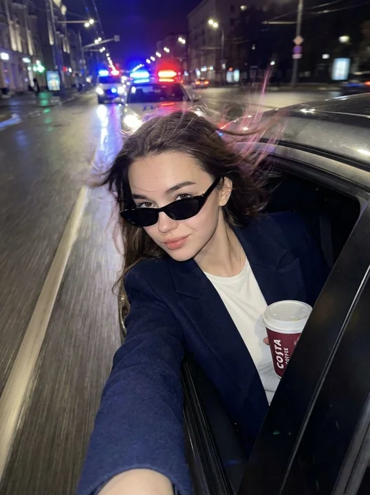 Movie-like rebellious selfie during a rainy night highway escape